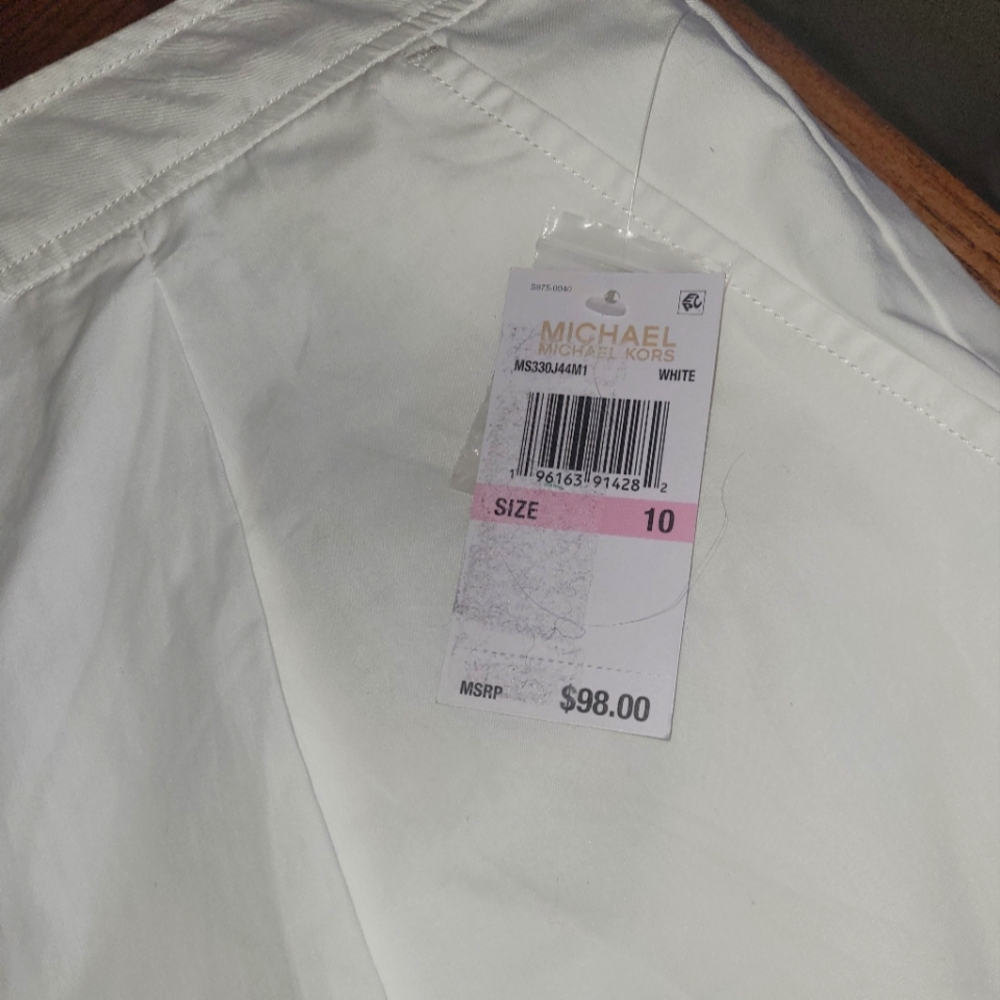 Michael Kors white shorts.